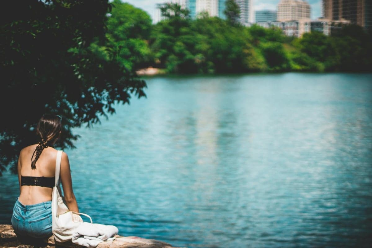 South Austin - Community amenities and recreational facilities Zilker Park or Barton Springs Pool area with families enjoying outdoor recreation